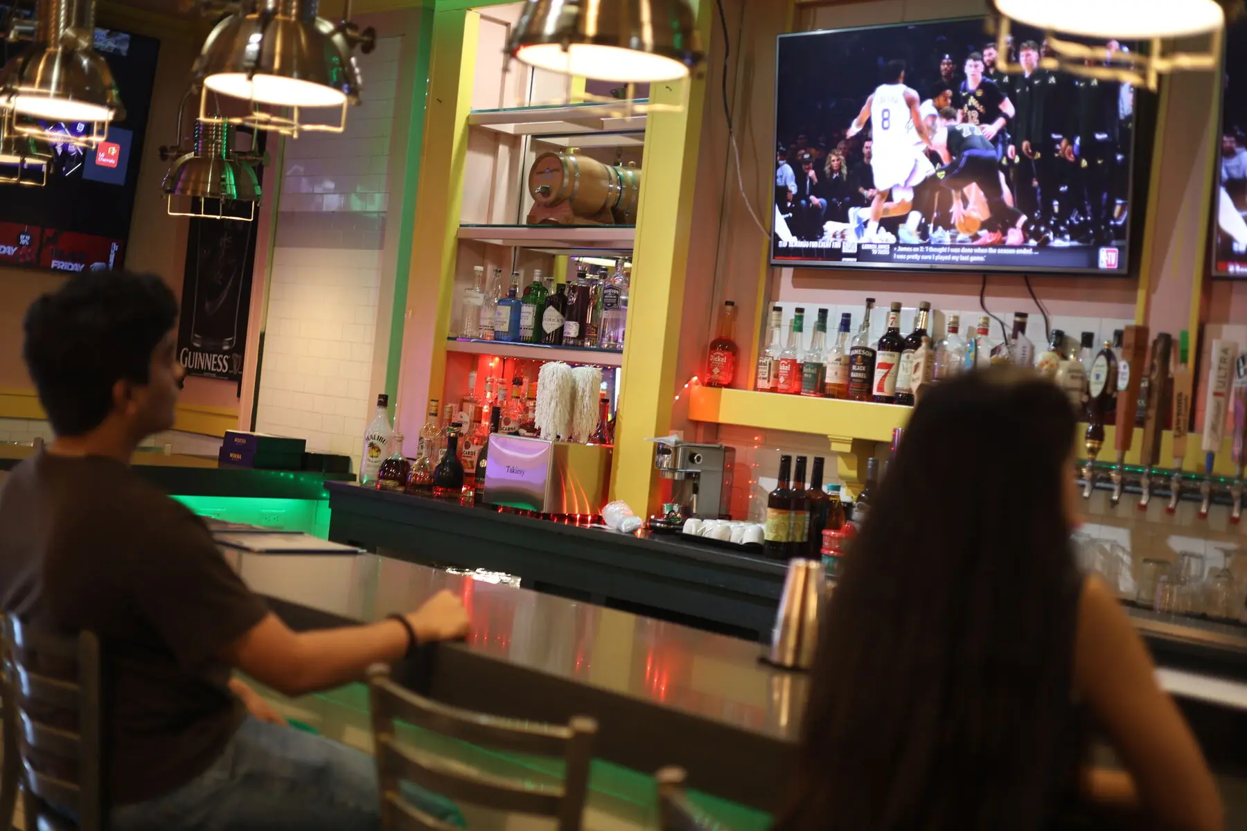 Guests at the bar watching the game