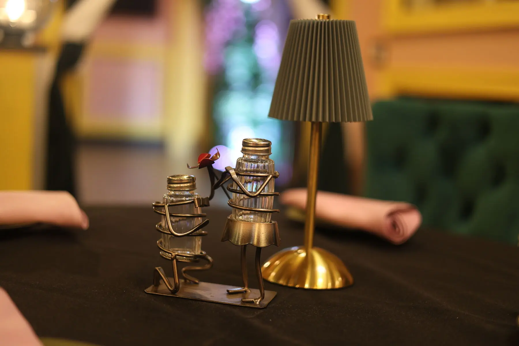 Whimsical salt and pepper shaker figures on the table
